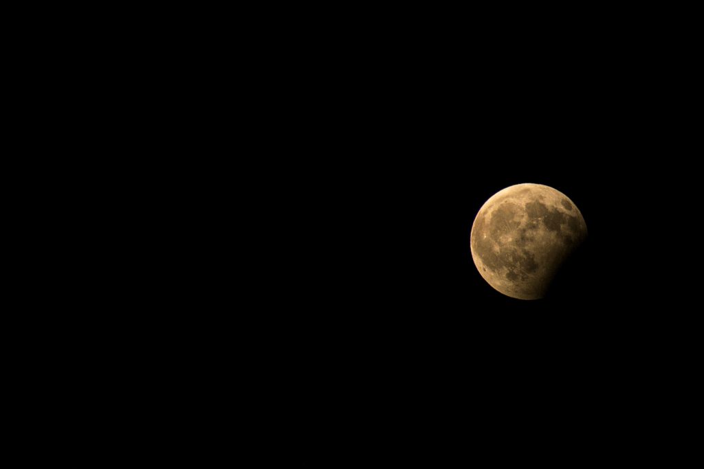 cratered moon in black sky