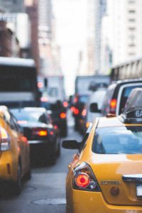 ny city street with traffic and taxis