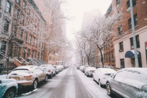 Manhattan upper west side street scene with snow on parked cars